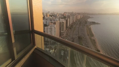 Sunset with skyline view through a balcony Stock Footage 90691696
