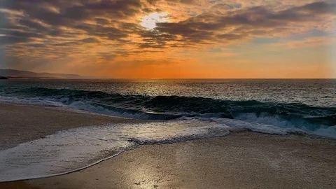 Sunset  SloMo Breaking Waves on beach Stock Footage 107626631
