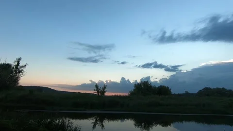 Sunset on a small river. Video stock 135332229
