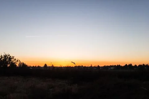Sunset with Smoke Rising Stock Photos