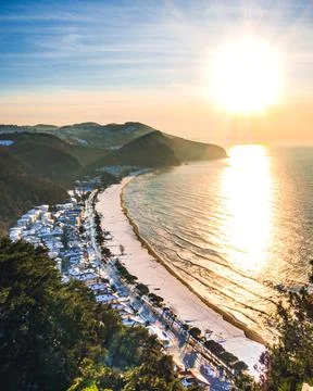 Sunset on a snow-covered beach Stock Photos