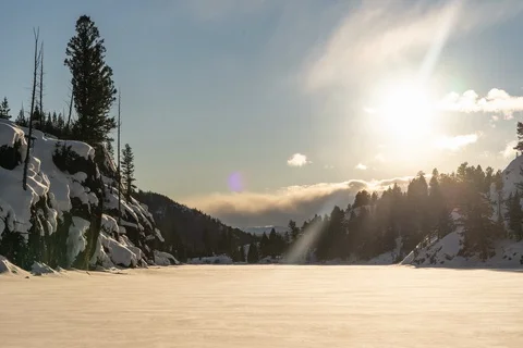 Sunset on snow covered lake Stock Footage 129862052