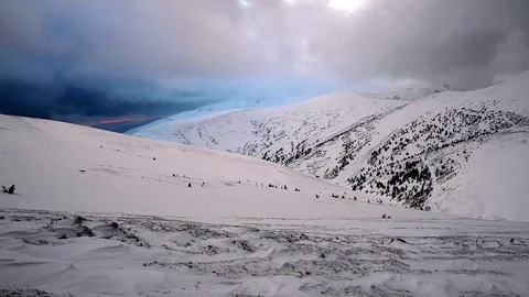 Sunset on the snow-covered mountain slope Video stock 101610970