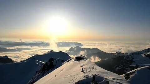 Sunset in the snow covered mountains Stock Footage 252435542