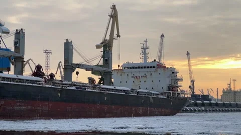 Sunset at Snowy Industrial Harbor Dock Stock Footage 257440698
