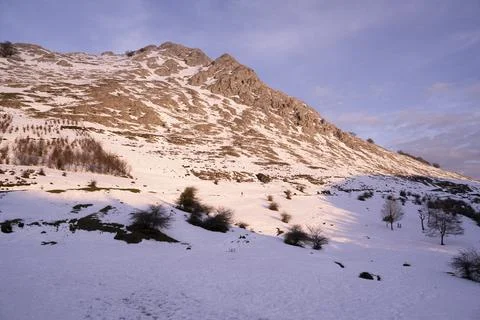 Sunset in a snowy mountain in winter, in the Basque Country, Spain Stock Photos
