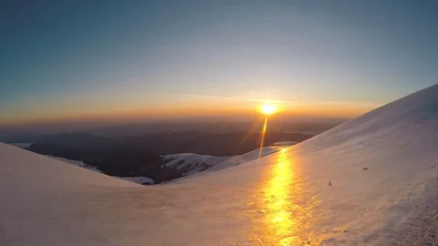 Sunset on the snowy mountains Stock Footage 106329547