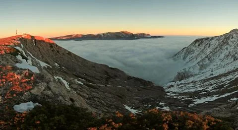 Sunset in snowy mountains Stock Photos