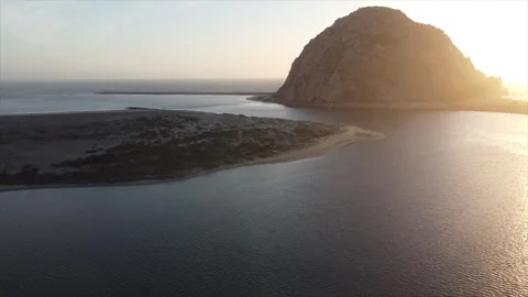 Sunset Soar: Drone Imagery of Morro Rock at Dusk - 1 Stock Footage 265071045