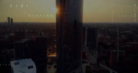 Sunset sparking binary streams floating over glass skyscraper and namespace Stock Footage 312898463