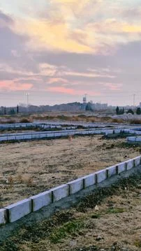 Sunset in the steppe. The dried grass has covered the field Stock Photos