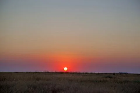 Sunset in the steppe Stock Photos