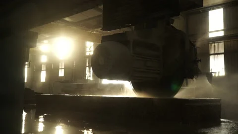 Sunset with a stone cutting machine working Stock Footage 237340882