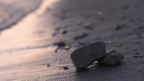 A sunset with stones on the beach 스톡 동영상 118976107