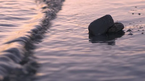 A sunset with stones on the beach Video stock 118976169