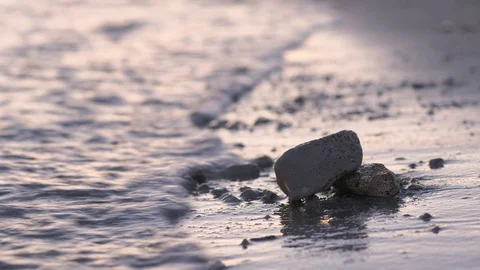 A sunset with stones on the beach Video stock 118976239