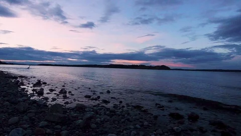 Sunset on a stony beach Stock Footage 111849301