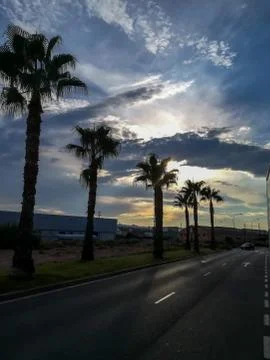 Sunset with storm clouds over mountains Stock Photos