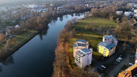 Sunset in the suburbs of Germany. Ddrone. River in the city. Boats. Wildlife. Stock Footage 231784399