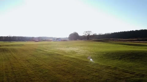 Sunset in the suburbs of Germany. Golf courses from above. Drone video. Stock Footage 231785360