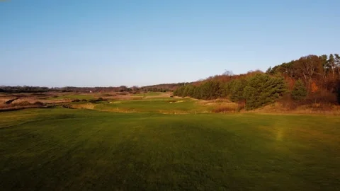 Sunset in the suburbs of Germany. Golf courses from above. Drone video. Stock Footage 231785367