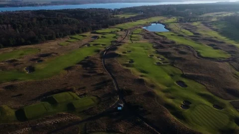 Sunset in the suburbs of Germany. Golf courses from above. Drone video. Stock Footage 231785549