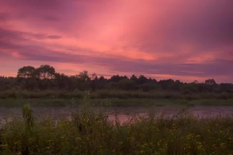 Sunset summer rain on river Stock-Fotos