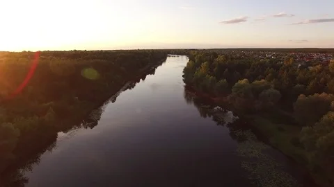 Sunset, summer time, river and green forest, View from drone landscape above. Stock Footage 79570036