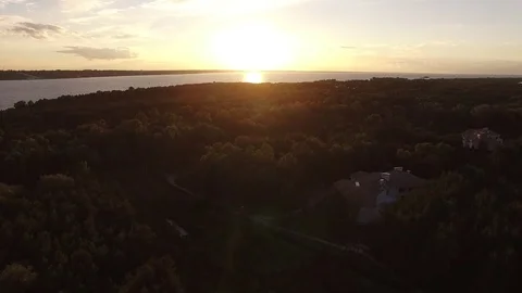 Sunset, summer time, river and green forest, View from drone landscape above. Stock Footage 79570088
