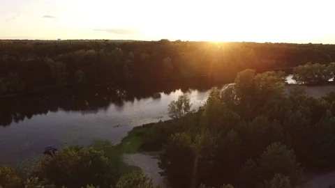 Sunset, summer time, river and green forest, View from drone landscape above. Stock Footage 79570092