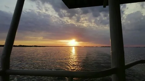 Sunset in the summer while walking on the river on a ship Stock Footage 133115162