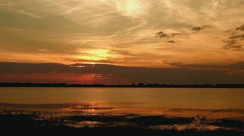 Sunset of a sun above a lake Stock-Footage 33075475