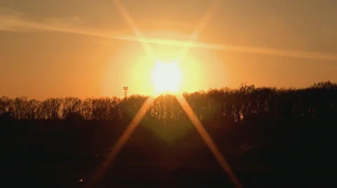 Sunset of a sun above trees Video stock 37535898