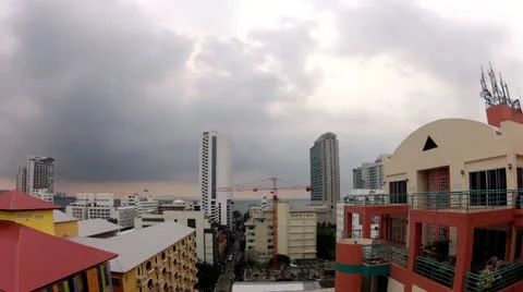 Sunset with sun and clouds, urban skyline, timelapse Stock Footage 10870345