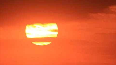 Sunset sun appearing from clouds Stock Footage 136391391