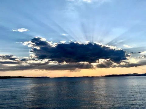 Sunset with sun behind cloud in Split Croatia 스톡 사진