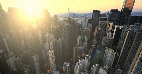 Sunset sun. Hong Kong skyscrapers aerial panoramic view. Beautiful urban city Vídeos de archivo