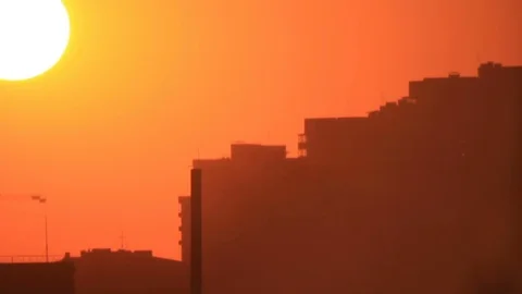 Sunset sun over town Stock Footage 84723095