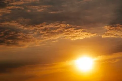 Sunset with sun rays and clouds Stock Photos