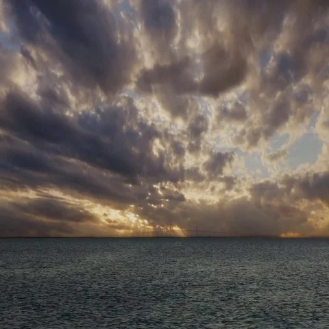 Sunset with Sun Rays Over Skyway Suspension Bridge TIme-lapse, 4K Stock Footage 69526127