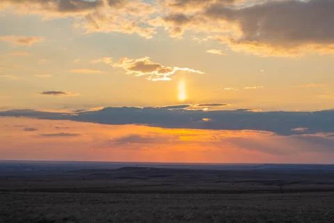 Sunset, sun rays through the clouds Stock Photos