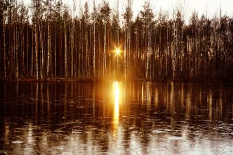 Sunset sun is reflected in the river water Stock Photos
