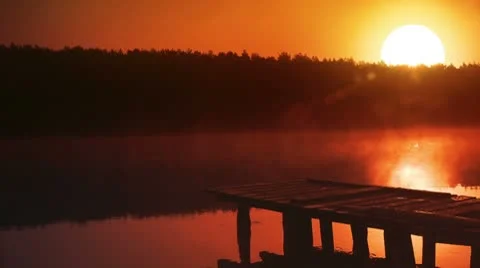 Sunset - sun reflecting in the lake. Romantic sight. Loop. Stock Footage