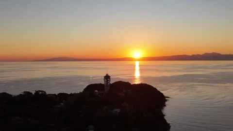 Sunset Sun Road Reflection Enoshima | Silhouette Aerial 4K Stock Footage 329055316