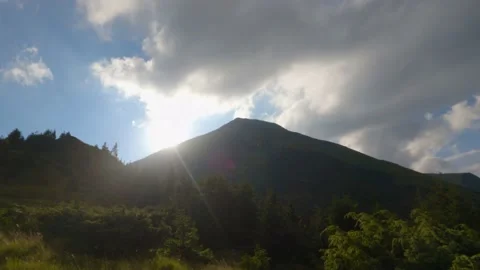 Sunset. Sun sets behind mountain. Timelapse 스톡 동영상 211100757