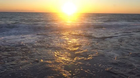 Sunset of sun setting over pacific ocean on windy evening Stock Footage 82008993
