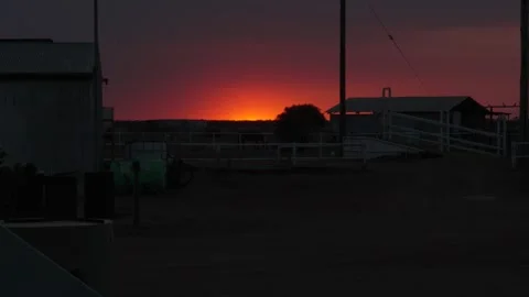 Sunset sun setting over rural farm homestay in Australia outback remote Stock Footage 287350660