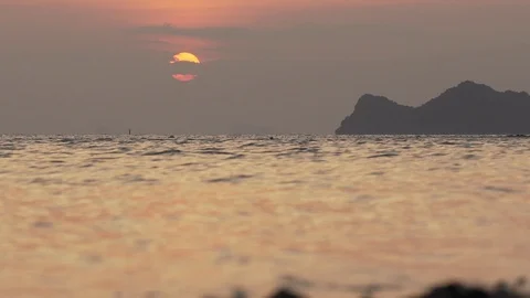 Sunset of sun setting over the sea on evening island. Slow motion water surface Video stock 89206288