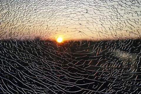 Sunset sun through broken glass, evening Stock Photos
