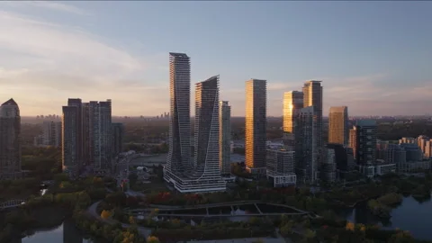 Sunset Sunburst Reflection on Modern Glass Skyscrapers Aerial Stock Footage 345684452